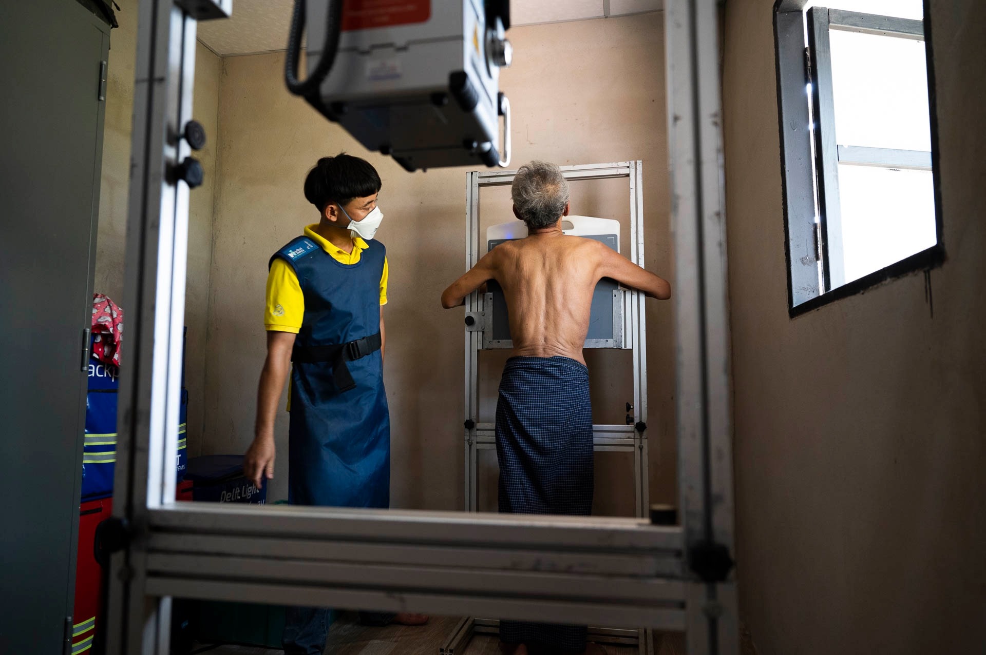 A radiographer is screening a patient with Delft Light in Thailand