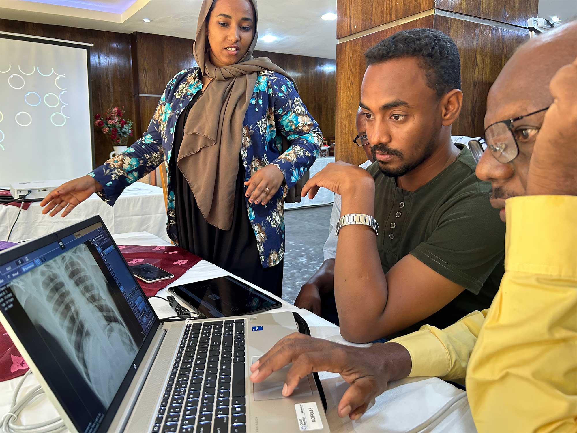 The radiographer in Sudan is looking at the CAD4TB platform