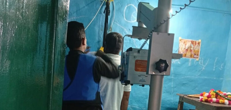 A radiographer is using Delft Light to screen patient in Nepal