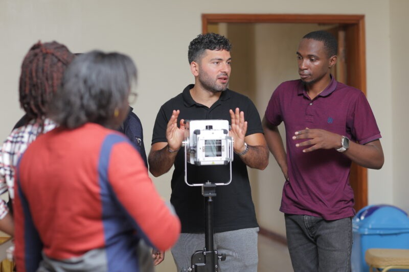 A Delft Imaging trainer demonstrating the Delft Light X-ray system to health workers during a training session in Uganda.