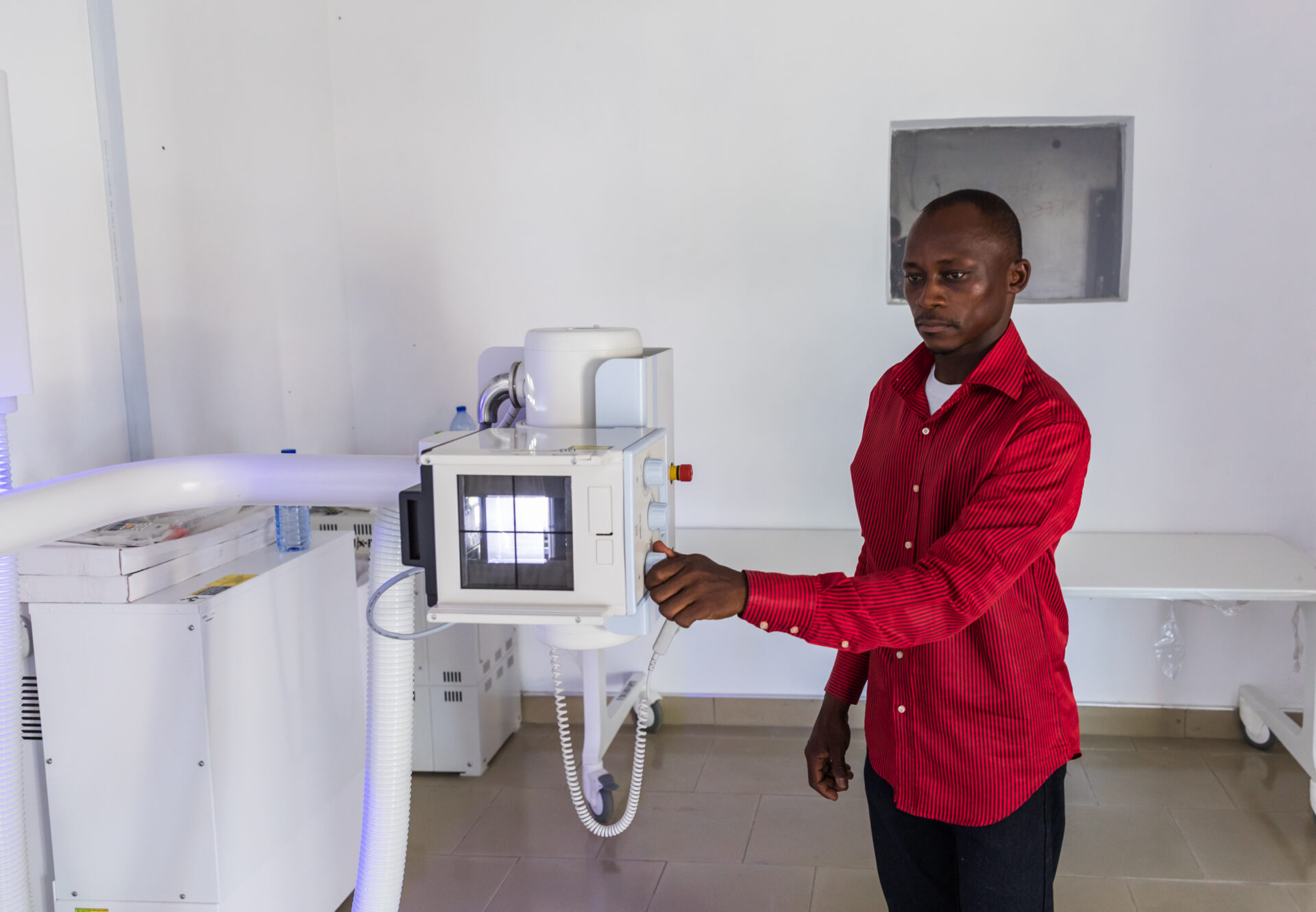 A radiographer is checking the EasyDR in Ghana