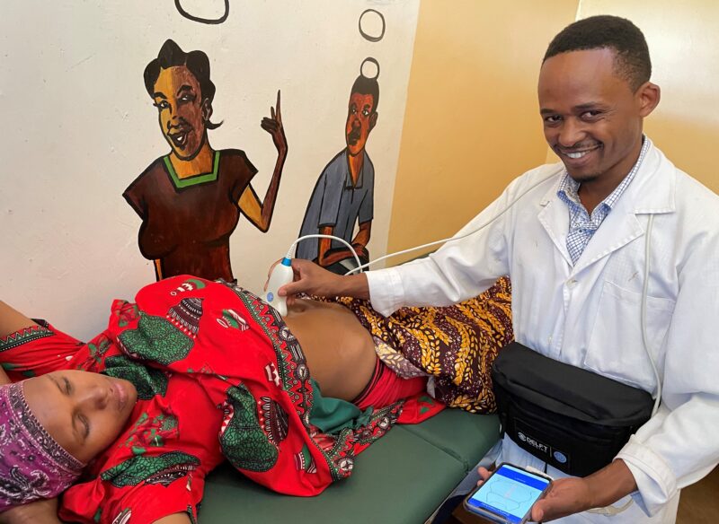 Erick - the nurse uses BabyChecker to scan a pregnant women in Tanzania