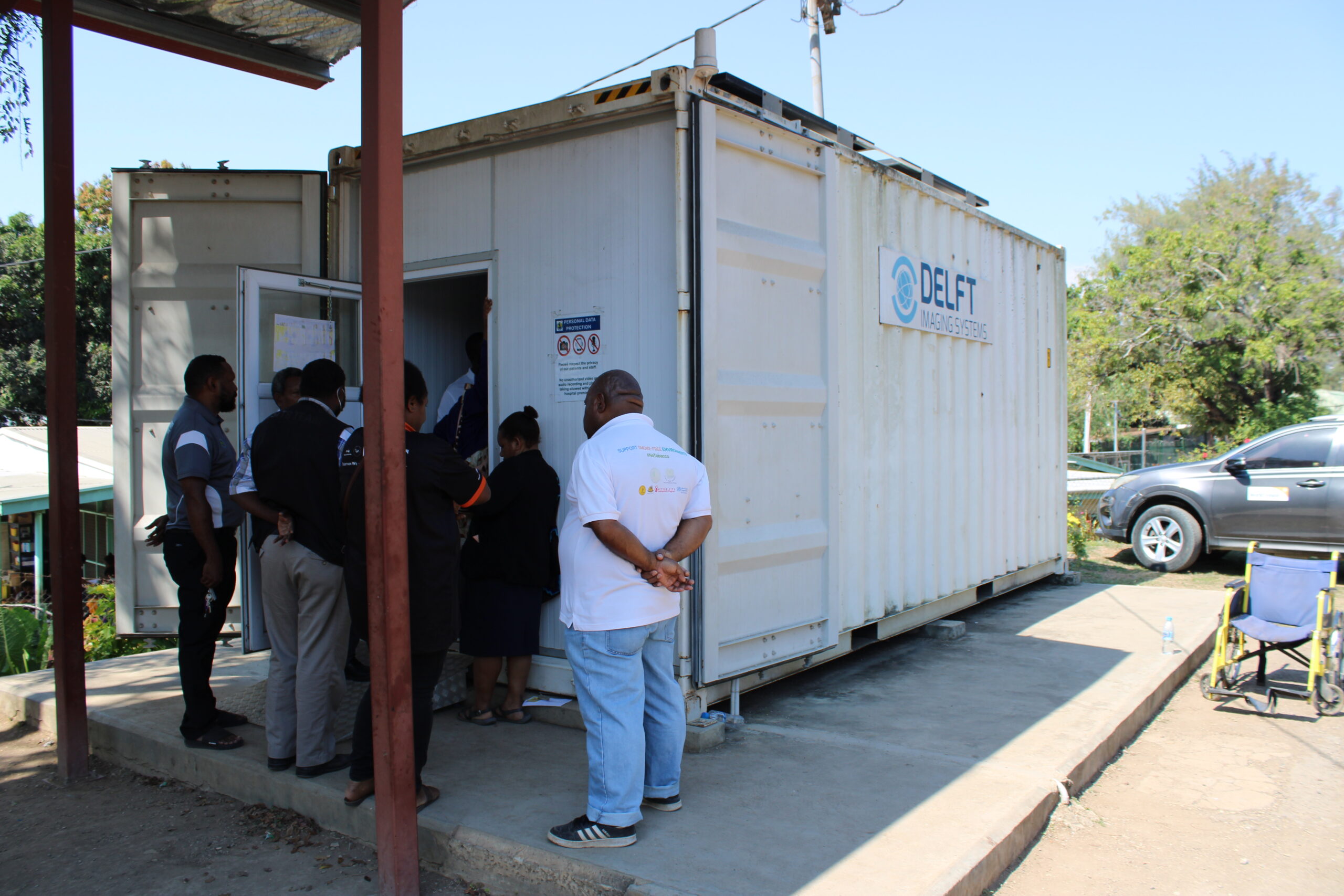 A line of people waiting in front of the mobile clinics in Papua New Guinea to get chest X-ray screening