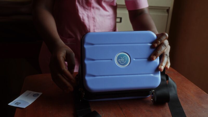 A midwife opens BabyChecker case